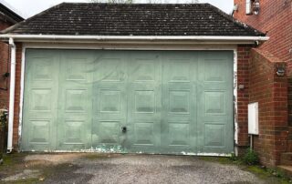 Battered up-and-over garage door