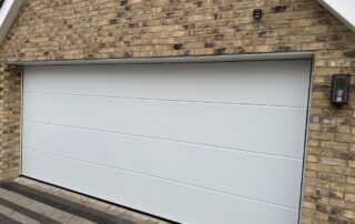 Double Hormann sectional garage door in a white silkgrain finish