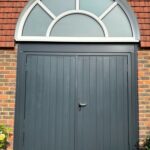Side-hinged Garador garage doors in anthracite grey