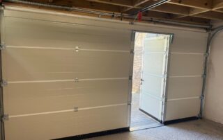 Side-opening door in a garage door